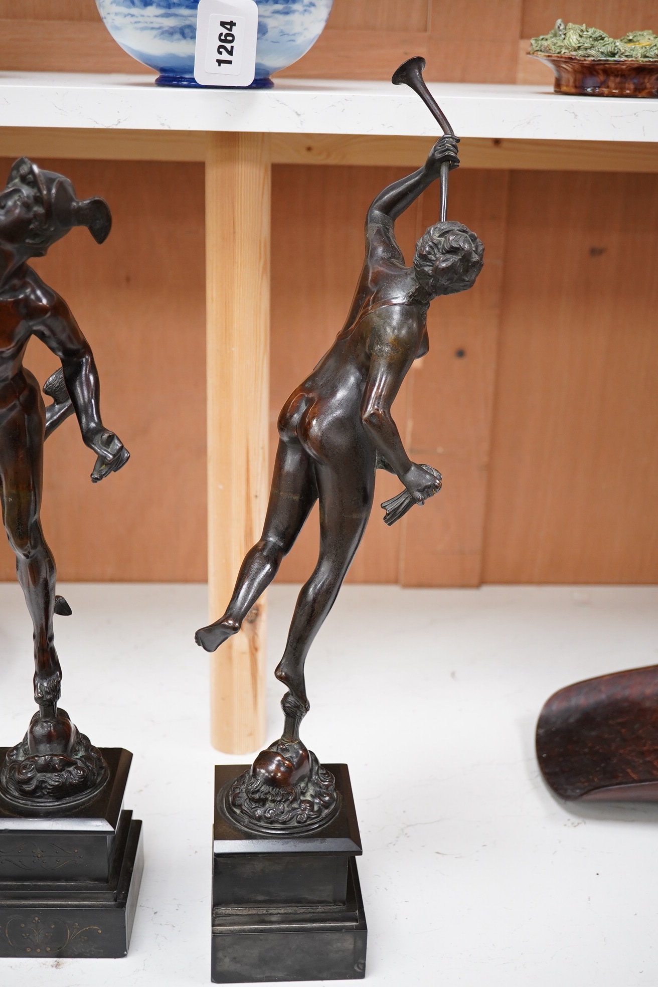 After the Antique, a pair of late 19th century bronze figures of Mercury and Fortune, each mounted on a black slate socle, with incised decoration, 51cm high. Condition - Mercury has his sceptre missing and Pheme has a b